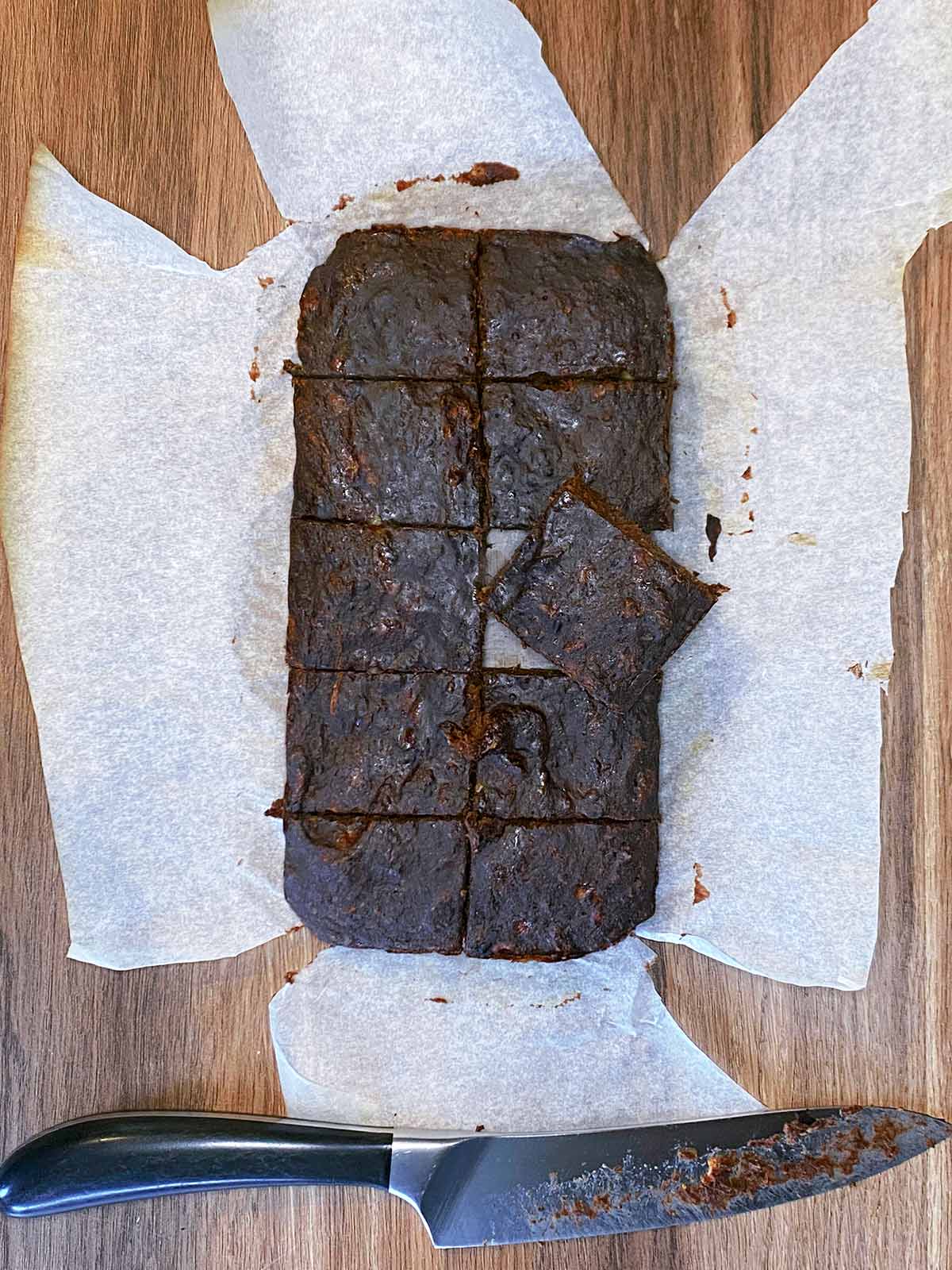 Cooked brownie cut into ten squares.