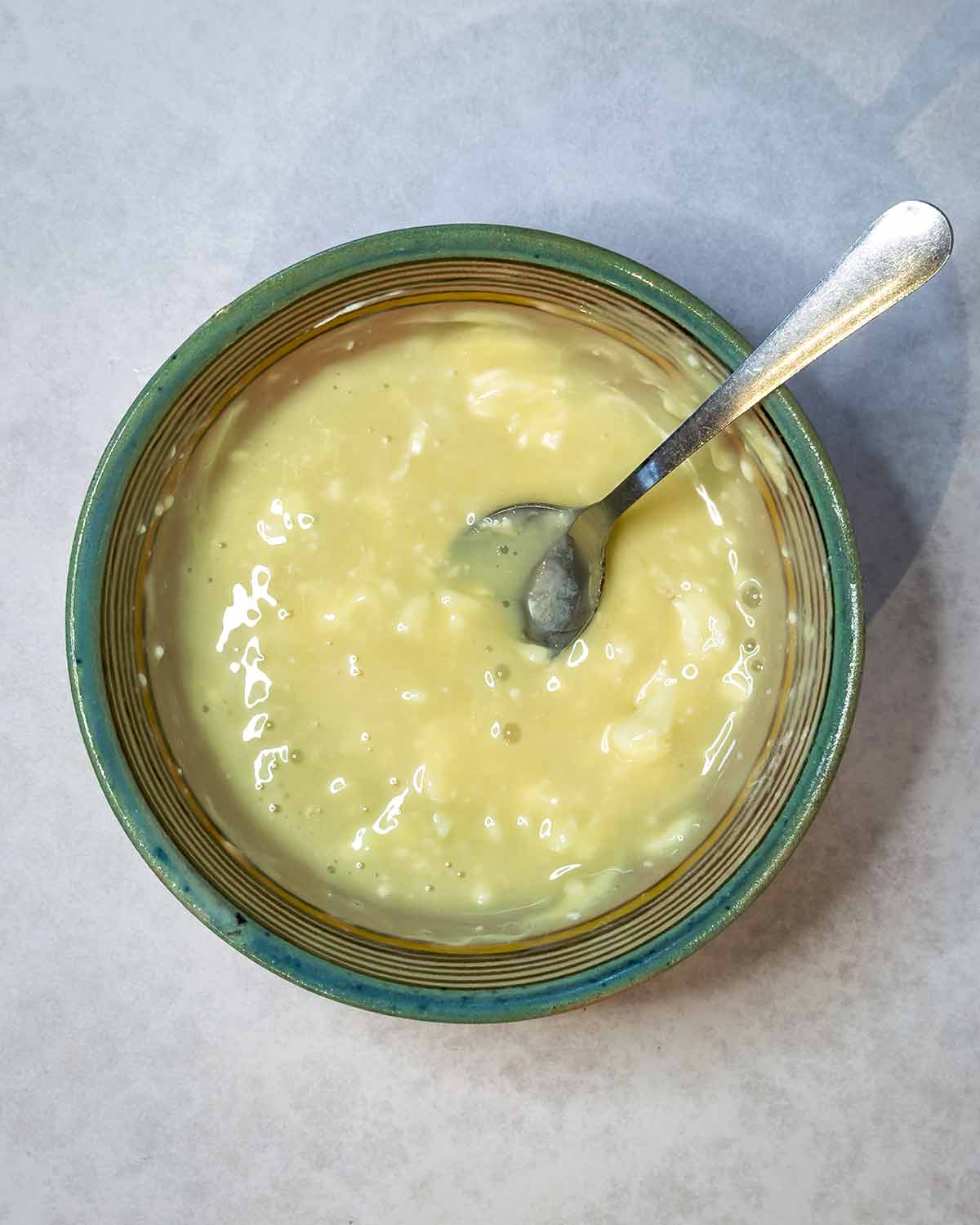 The cream cheese and honey mixed together in the bowl.