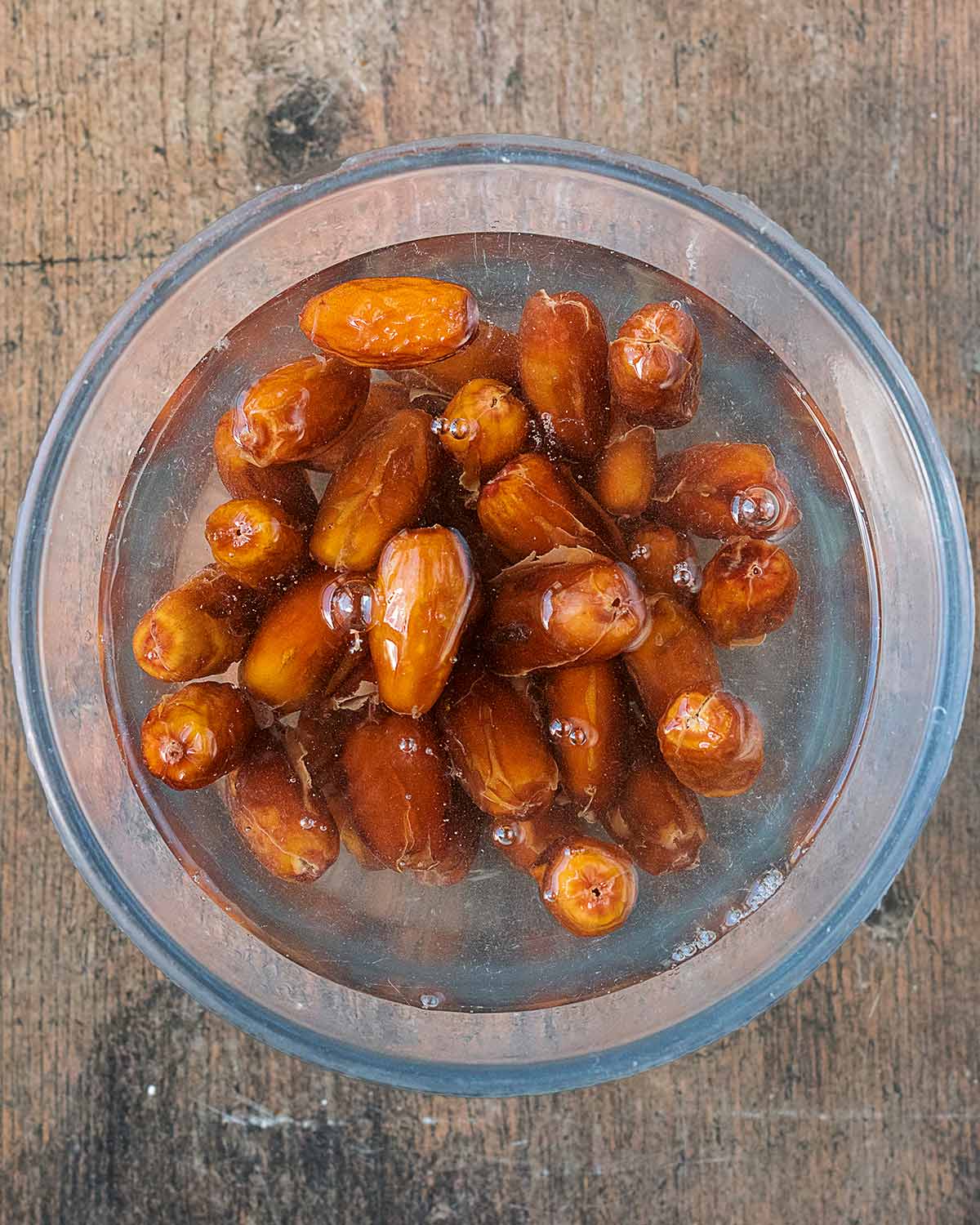 Dates soaking in a bowl of water.