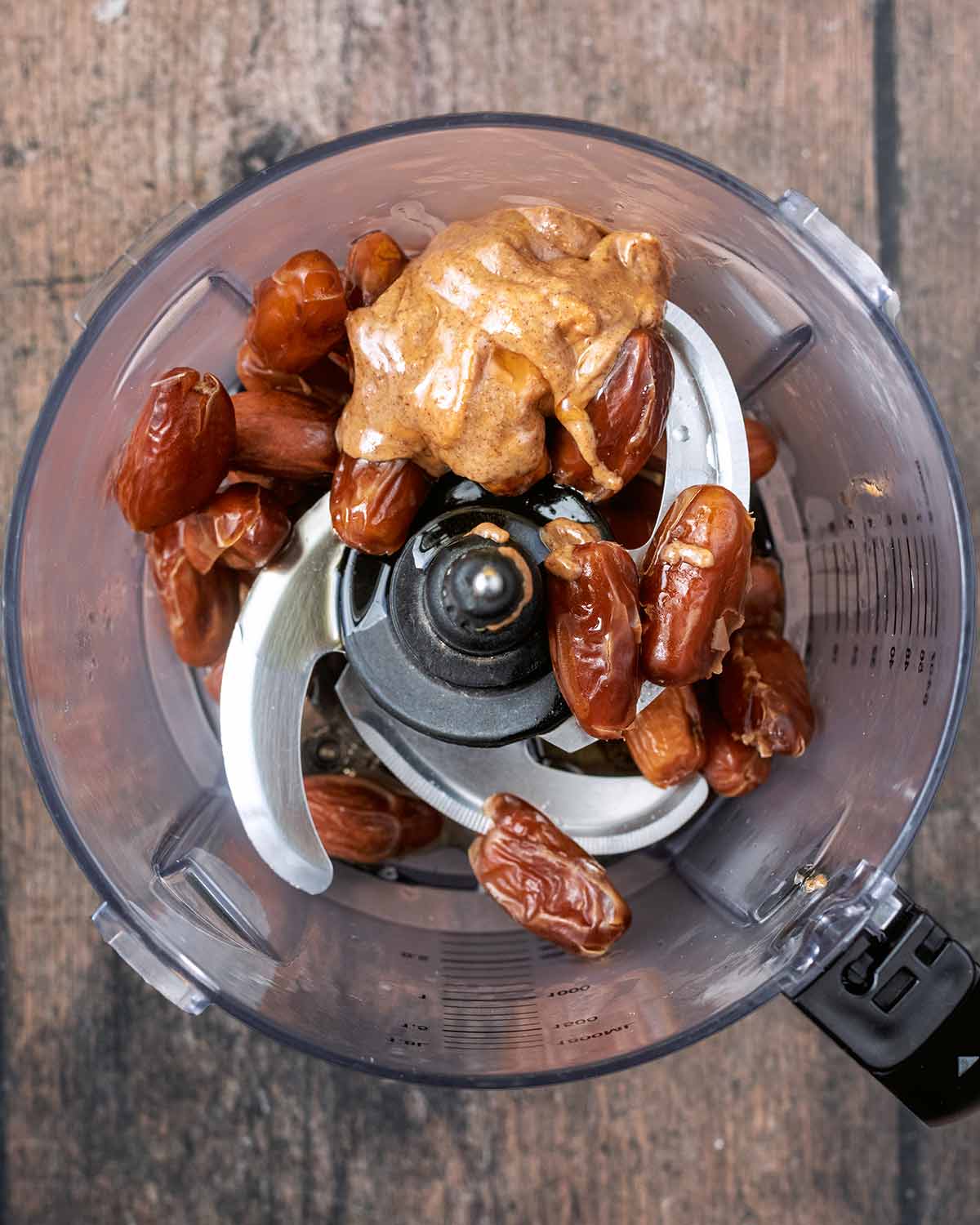Dates and nut butter in a food processor.